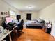 Bedroom featuring a bed, desk, hardwood floors, and closet with natural light at 792 Oneta Dr, Norcross, GA 30093