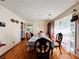 Dining room with hardwood floors, large window, and classic-style table and chairs at 792 Oneta Dr, Norcross, GA 30093