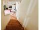 Interior view from the top of the staircase looking into an open dining and living area at 792 Oneta Dr, Norcross, GA 30093