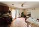 Spacious kitchen with tile floors, ceiling fan, cabinets, appliances, and access to the backyard at 792 Oneta Dr, Norcross, GA 30093