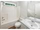 Bathroom with tub-shower combination, single sink vanity, and updated fixtures at 834 Winding Grove Ln, Loganville, GA 30052
