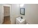 Cozy bathroom featuring vanity with a mirror, tile flooring and a doorway to a laundry room at 834 Winding Grove Ln, Loganville, GA 30052