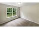 Bedroom featuring plush carpet and a window with a backyard view at 834 Winding Grove Ln, Loganville, GA 30052