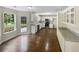 Bright kitchen with stainless steel appliances, granite countertops, white cabinets and a view of backyard at 834 Winding Grove Ln, Loganville, GA 30052