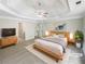 Spacious main bedroom with a decorative ceiling and large picture window at 834 Winding Grove Ln, Loganville, GA 30052