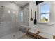 Bathroom with a glass-enclosed shower, built-in seat, and decorative paddles on the wall at 1107 Rivard Nw Cir, Atlanta, GA 30318