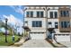 Charming townhomes feature attached garages, painted brick, and modern architectural details at 1107 Rivard Nw Cir, Atlanta, GA 30318