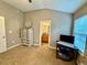 Carpeted bedroom with vaulted ceiling features a tall dresser and leads into the on-suite bathroom at 2167 Del Lago Cir # 11, Kennesaw, GA 30152