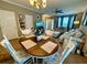 Open concept dining space with dining area and a view towards the entrance and living room at 2167 Del Lago Cir # 11, Kennesaw, GA 30152