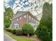 Beautiful brick home with manicured landscaping, a charming bay window, and lush greenery at 2167 Del Lago Cir # 11, Kennesaw, GA 30152