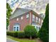 Beautiful brick home with manicured landscaping, a charming bay window, and lush greenery at 2167 Del Lago Cir # 11, Kennesaw, GA 30152