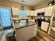 Bright kitchen with granite countertops, stainless steel appliances, and ample cabinet space at 2167 Del Lago Cir # 11, Kennesaw, GA 30152