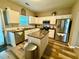 Well-lit kitchen featuring stainless steel appliances, granite counters and modern cabinetry at 2167 Del Lago Cir # 11, Kennesaw, GA 30152