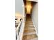 Carpeted staircase leading up to the next floor, with a white banister and natural light at 2167 Del Lago Cir # 11, Kennesaw, GA 30152