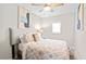 Inviting bedroom with patterned bedding, decorative pillows, and soft lighting creating a comfortable and stylish retreat at 246 Aurora Nw Ave, Atlanta, GA 30314