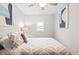 Inviting bedroom with patterned bedding, decorative pillows, and soft lighting creating a comfortable and stylish retreat at 246 Aurora Nw Ave, Atlanta, GA 30314