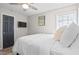 Comfortable bedroom with hardwood floors, a ceiling fan, and cozy bedding offering a relaxing living space at 246 Aurora Nw Ave, Atlanta, GA 30314
