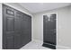 Clean entryway with marble tile floors, gray doors, and ample closet space creating an organized welcome at 246 Aurora Nw Ave, Atlanta, GA 30314
