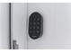 Close-up of a secure smart lock on a white door for keyless entry and added home security features at 246 Aurora Nw Ave, Atlanta, GA 30314