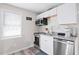 Efficient kitchen with stainless steel appliances, granite countertops, and white cabinets at 246 Aurora Nw Ave, Atlanta, GA 30314