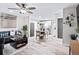 Open-concept living room featuring modern decor, updated flooring, and stainless steel appliances at 246 Aurora Nw Ave, Atlanta, GA 30314