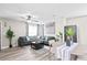 Open living area with a sectional, decorative plants, and a view of the dining area at 246 Aurora Nw Ave, Atlanta, GA 30314