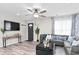 Inviting living room with a sectional sofa, mounted TV, and stylish decor at 246 Aurora Nw Ave, Atlanta, GA 30314