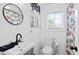 Bright bathroom featuring a modern vanity, stylish mirror, and a decorated shower curtain at 251 Aurora Nw Ave, Atlanta, GA 30314