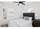 Bright bedroom featuring hardwood floors, a modern ceiling fan, and a large window at 251 Aurora Nw Ave, Atlanta, GA 30314
