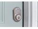 Keypad lock on a light blue front door, providing enhanced security and convenience at 251 Aurora Nw Ave, Atlanta, GA 30314