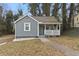 Charming bungalow-style home with a welcoming front porch and freshly painted exterior in a neutral color at 251 Aurora Nw Ave, Atlanta, GA 30314