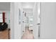 Bright hallway with hardwood floors leading to a bedroom with white walls and natural light at 251 Aurora Nw Ave, Atlanta, GA 30314