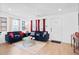 Cozy living room with bright windows, dark sofas, and modern decor at 251 Aurora Nw Ave, Atlanta, GA 30314
