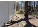 Home exterior view of backyard with partial brick pathway at 2184 E Cherokee Dr, Woodstock, GA 30188