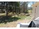 Spacious backyard with trees, a picnic table, and a wooden fence at 2184 E Cherokee Dr, Woodstock, GA 30188
