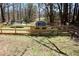 Large back yard with a wooden fence, a trampoline, and shed at 2184 E Cherokee Dr, Woodstock, GA 30188