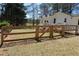 Fenced backyard features a gated entrance leading to the property at 2184 E Cherokee Dr, Woodstock, GA 30188