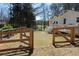 View of backyard with wooden fence, home, and deck at 2184 E Cherokee Dr, Woodstock, GA 30188
