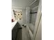 Bathroom with tiled shower and built-in shelving at 2184 E Cherokee Dr, Woodstock, GA 30188