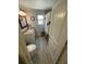 Bright bathroom with wood floors, single vanity and shower at 2184 E Cherokee Dr, Woodstock, GA 30188
