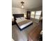 Comfortable bedroom with neutral colors, bedside tables and lamps at 2184 E Cherokee Dr, Woodstock, GA 30188