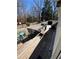 Large wooden deck with dining table and chairs perfect for outdoor entertaining at 2184 E Cherokee Dr, Woodstock, GA 30188