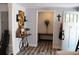 Home foyer with table decorated with flowers and art at 2184 E Cherokee Dr, Woodstock, GA 30188