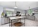 Charming kitchen with gray cabinets, stainless appliances, and a marble island at 2184 E Cherokee Dr, Woodstock, GA 30188