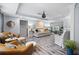 Bright living room features hardwood floors, neutral paint and modern finishes at 2184 E Cherokee Dr, Woodstock, GA 30188