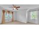 This bedroom features dual windows and natural light with plush carpet flooring at 2702 Moorings Pkwy, Snellville, GA 30039