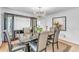 Formal dining room featuring modern furnishings, elegant chandelier, and decorative cabinet at 2702 Moorings Pkwy, Snellville, GA 30039