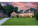 Stunning brick home with a lush green lawn and a long driveway, perfect for suburban living at 2702 Moorings Pkwy, Snellville, GA 30039