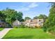 Charming brick home with a well-manicured lawn, dormer windows and a long driveway leading to a two-car garage at 2702 Moorings Pkwy, Snellville, GA 30039