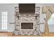 Close up view of the brick fireplace with a mantel, perfect for a cozy home at 2702 Moorings Pkwy, Snellville, GA 30039